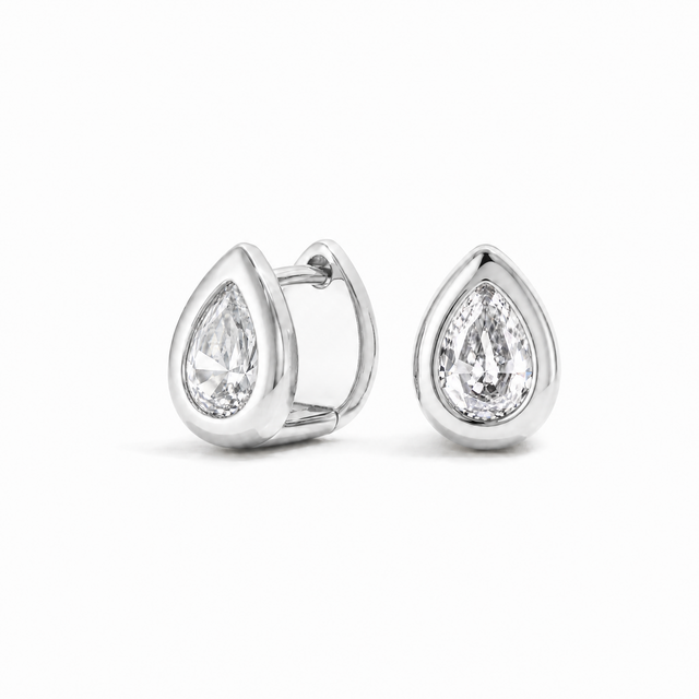 Sculpted Teardrop Hoops in a white-gold-plated finish with pear-cut white cubic zirconia.