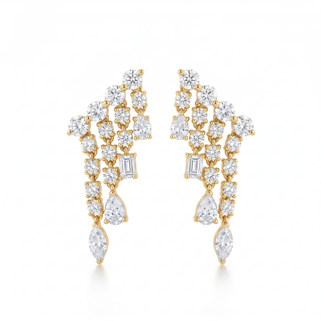 Mixed-Cut Cascade Studs with several descending rows of white cubic zirconia in gold-plated settings.