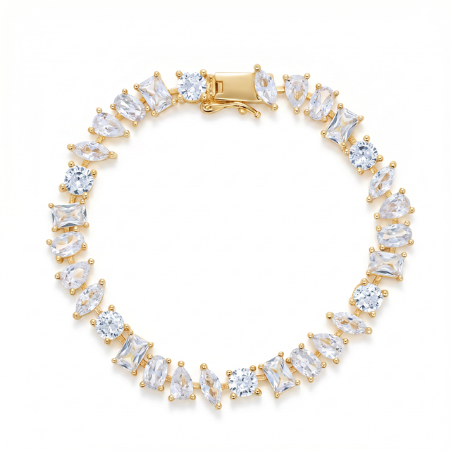 Mixed-Cut Prism Tennis Bracelet with white cubic zirconia in varied shapes and gold-plated settings.