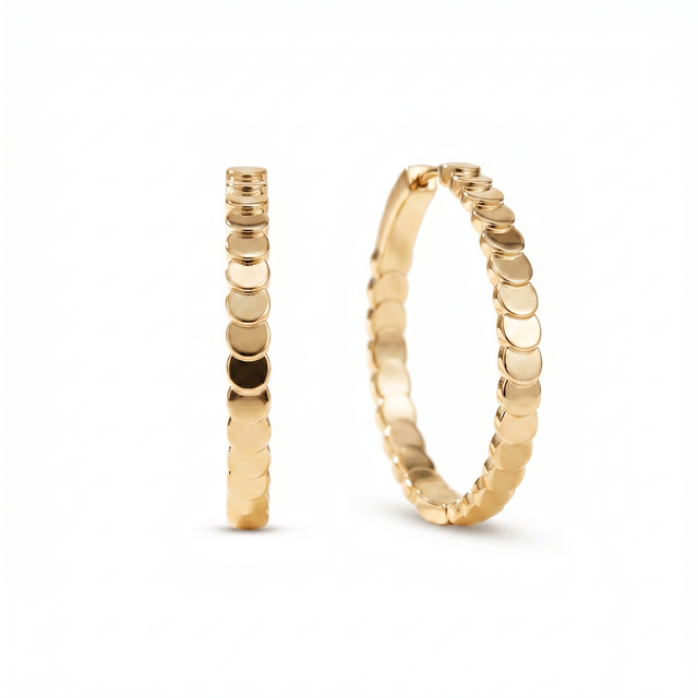Luna Sculpted Hoop Earrings with a scalloped row of polished gold-plated discs.